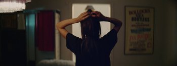 Movie still from “Jesse Jo Stark - So Bad” (2022), directed by Ramez Silyan – Close Up shot, Over the shoulder angle