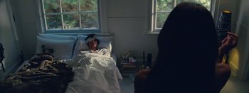 Movie still from “Jesse Jo Stark - So Bad” (2022), directed by Ramez Silyan – Medium shot, High angle