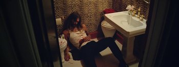 Movie still from “Jesse Jo Stark - So Bad” (2022), directed by Ramez Silyan – Medium shot, Overhead angle