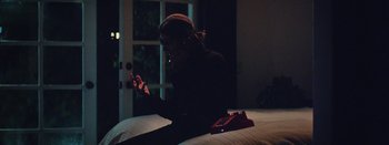 Movie still from “Jesse Jo Stark - So Bad” (2022), directed by Ramez Silyan – Medium shot, High angle