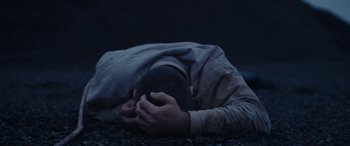 Movie still from “Röyksopp - Profound Mysteries” (2022), directed by Martin De Thurah – Close Up shot, Overhead angle