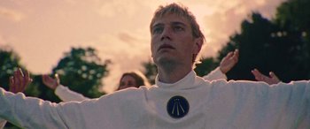 Movie still from “Röyksopp - Profound Mysteries” (2022), directed by Martin De Thurah – Close Up shot, Low angle