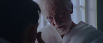 Movie still from “Röyksopp - Profound Mysteries” (2022), directed by Martin De Thurah – Extreme Close Up shot, Over the shoulder angle