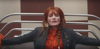 Movie still from “Florence + The Machine - Free” (2022), directed by Autumn de Wilde – Medium shot, High angle