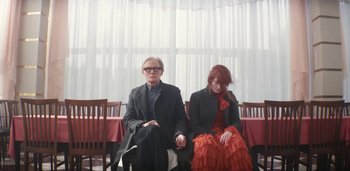 Movie still from “Florence + The Machine - Free” (2022), directed by Autumn de Wilde – Medium shot, Low angle