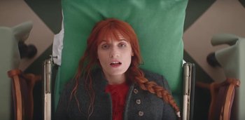 Movie still from “Florence + The Machine - Free” (2022), directed by Autumn de Wilde – Medium shot, Overhead angle