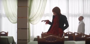 Movie still from “Florence + The Machine - Free” (2022), directed by Autumn de Wilde – Medium shot, Low angle