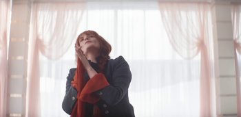 Movie still from “Florence + The Machine - Free” (2022), directed by Autumn de Wilde – Medium shot, Low angle
