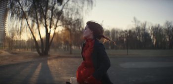 Movie still from “Florence + The Machine - Free” (2022), directed by Autumn de Wilde – Medium shot, Low angle