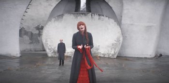 Movie still from “Florence + The Machine - Free” (2022), directed by Autumn de Wilde – Medium shot, Low angle