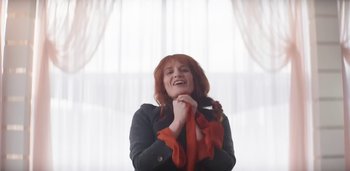 Movie still from “Florence + The Machine - Free” (2022), directed by Autumn de Wilde – Medium shot, Low angle