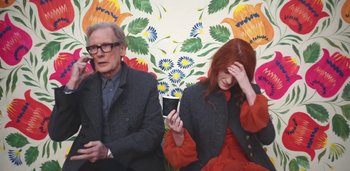 Movie still from “Florence + The Machine - Free” (2022), directed by Autumn de Wilde – Medium shot, Low angle