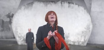 Movie still from “Florence + The Machine - Free” (2022), directed by Autumn de Wilde – Medium shot, Low angle