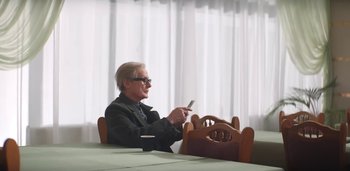 Movie still from “Florence + The Machine - Free” (2022), directed by Autumn de Wilde – Medium shot, Low angle