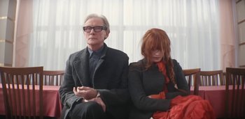 Movie still from “Florence + The Machine - Free” (2022), directed by Autumn de Wilde – Medium shot, Low angle