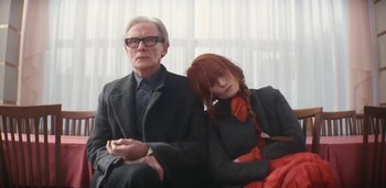 Movie still from “Florence + The Machine - Free” (2022), directed by Autumn de Wilde – Medium shot, Low angle