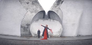 Movie still from “Florence + The Machine - Free” (2022), directed by Autumn de Wilde – Extreme Wide shot, Low angle