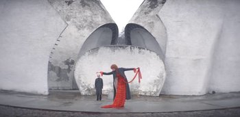 Movie still from “Florence + The Machine - Free” (2022), directed by Autumn de Wilde – Wide shot, Low angle