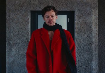 Movie still from “Harry Styles - As It Was” (2022), directed by Tanu Muiño – Medium shot, Low angle