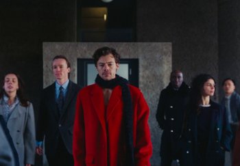 Movie still from “Harry Styles - As It Was” (2022), directed by Tanu Muiño – Medium shot, Low angle
