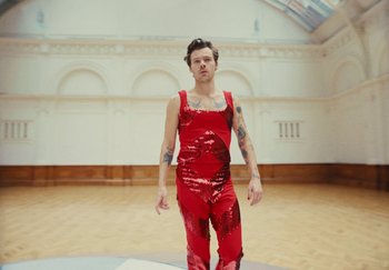 Movie still from “Harry Styles - As It Was” (2022), directed by Tanu Muiño – Medium shot, High angle