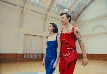 Movie still from “Harry Styles - As It Was” (2022), directed by Tanu Muiño – Medium shot, Low angle