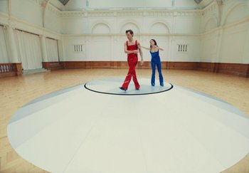 Movie still from “Harry Styles - As It Was” (2022), directed by Tanu Muiño – Wide shot, Low angle