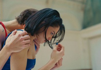 Movie still from “Harry Styles - As It Was” (2022), directed by Tanu Muiño – Medium shot, Low angle