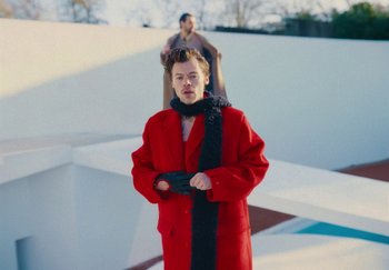 Movie still from “Harry Styles - As It Was” (2022), directed by Tanu Muiño – Medium shot, Over the shoulder angle