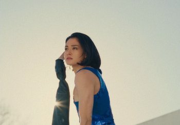 Movie still from “Harry Styles - As It Was” (2022), directed by Tanu Muiño – Medium shot, Low angle