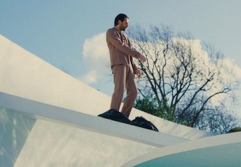 Movie still from “Harry Styles - As It Was” (2022), directed by Tanu Muiño – Wide shot, Low angle