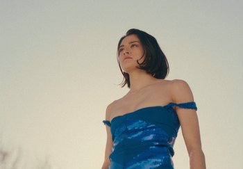 Movie still from “Harry Styles - As It Was” (2022), directed by Tanu Muiño – Medium shot, Low angle