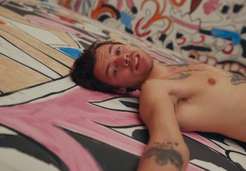 Movie still from “Harry Styles - As It Was” (2022), directed by Tanu Muiño – Medium shot, Overhead angle
