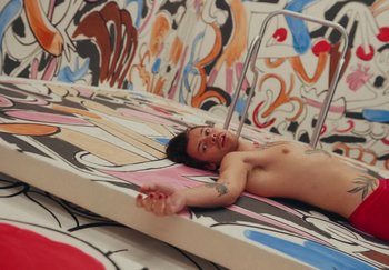 Movie still from “Harry Styles - As It Was” (2022), directed by Tanu Muiño – Wide shot, Overhead angle