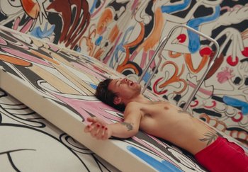 Movie still from “Harry Styles - As It Was” (2022), directed by Tanu Muiño – Wide shot, Overhead angle