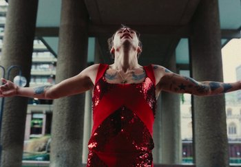Movie still from “Harry Styles - As It Was” (2022), directed by Tanu Muiño – Medium shot, Low angle