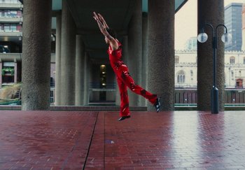 Movie still from “Harry Styles - As It Was” (2022), directed by Tanu Muiño – Wide shot, Low angle