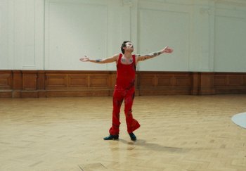 Movie still from “Harry Styles - As It Was” (2022), directed by Tanu Muiño – Wide shot, Low angle