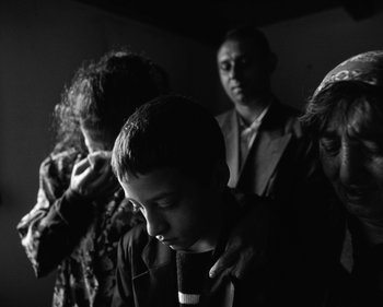 Movie still from “ZNTNDR - Wonderful Time” (2022), directed by Jovan Todorović – Close Up shot, High angle