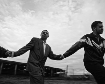 Movie still from “ZNTNDR - Wonderful Time” (2022), directed by Jovan Todorović – Medium shot, Low angle