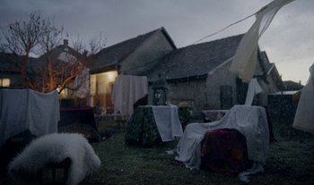 Movie still from “Anima Sound System - Dress Me In White” (2022), directed by Luka Kostil – Wide shot, Low angle