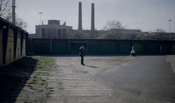 Movie still from “Anima Sound System - Dress Me In White” (2022), directed by Luka Kostil – Extreme Wide shot, High angle