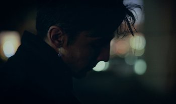 Movie still from “Anima Sound System - Dress Me In White” (2022), directed by Luka Kostil – Extreme Close Up shot, Low angle