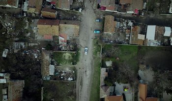 Movie still from “Anima Sound System - Dress Me In White” (2022), directed by Luka Kostil – Extreme Wide shot, Overhead angle