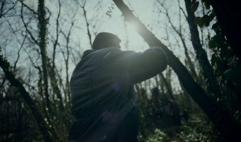 Movie still from “Anima Sound System - Dress Me In White” (2022), directed by Luka Kostil – Medium shot, Low angle