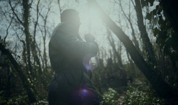 Movie still from “Anima Sound System - Dress Me In White” (2022), directed by Luka Kostil – Medium shot, Low angle