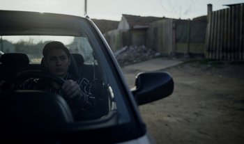 Movie still from “Anima Sound System - Dress Me In White” (2022), directed by Luka Kostil – Medium shot, Low angle