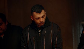 Movie still from “Anima Sound System - Dress Me In White” (2022), directed by Luka Kostil – Close Up shot, High angle