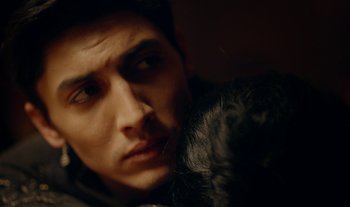 Movie still from “Anima Sound System - Dress Me In White” (2022), directed by Luka Kostil – Extreme Close Up shot, Over the shoulder angle