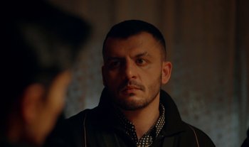 Movie still from “Anima Sound System - Dress Me In White” (2022), directed by Luka Kostil – Close Up shot, Over the shoulder angle